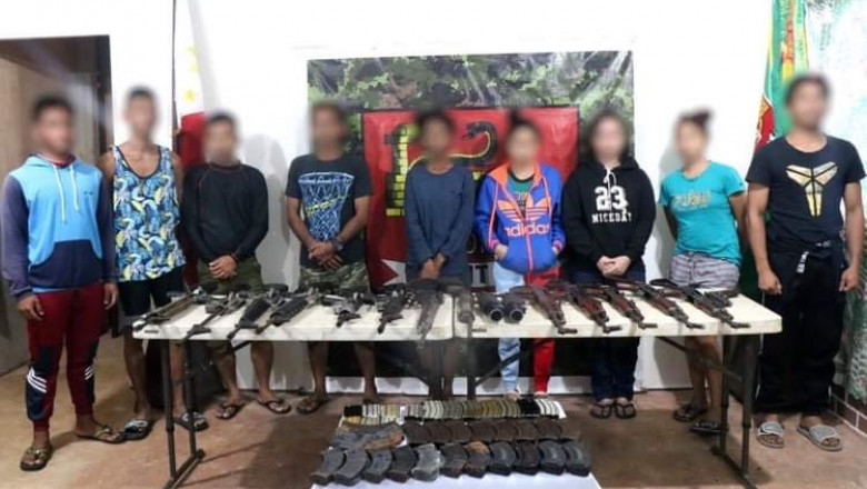 9 NPA members with 16 guns surrender to soldiers in Surigao del Norte